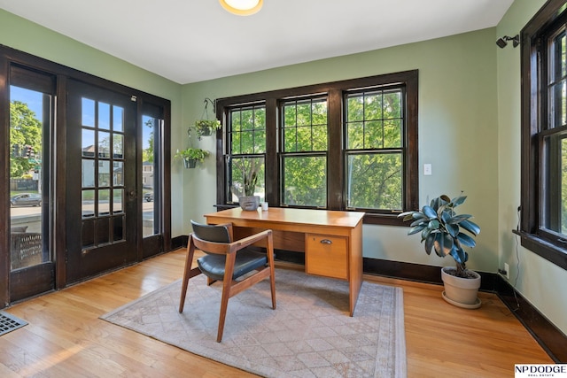 home office with light wood-style floors