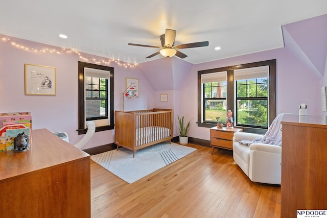 bedroom with multiple windows, light wood finished floors, baseboards, recessed lighting, and a ceiling fan
