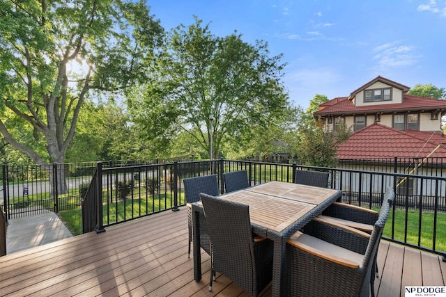 wooden terrace featuring outdoor dining area