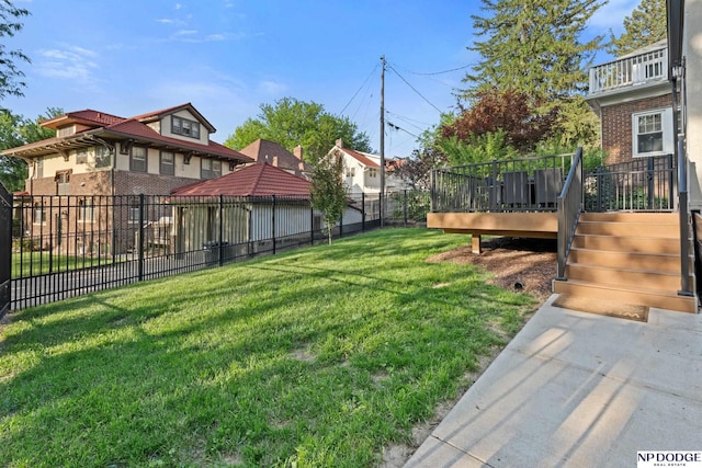 view of yard featuring a wooden deck