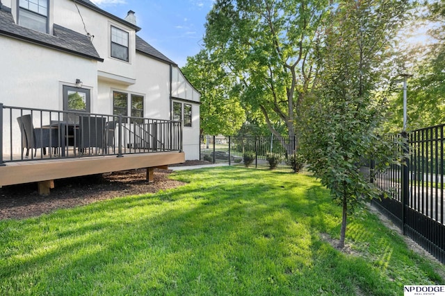 view of yard featuring a wooden deck