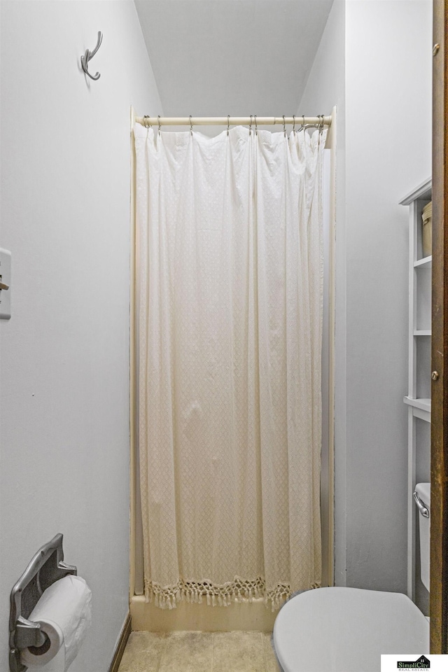 3041 Orwell St, Lincoln, NE 68516 - bathroom featuring toilet, tile patterned floors, and a shower with curtain