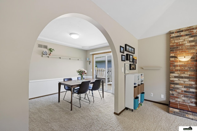 3041 Orwell St, Lincoln, NE 68516 - carpeted dining area featuring arched walkways and baseboards