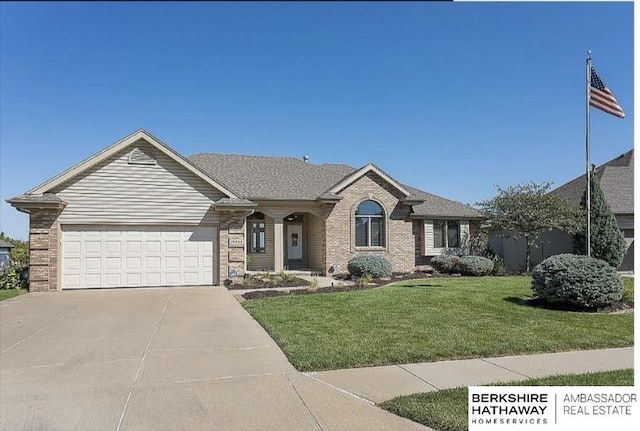 15922 Curtis Ave, Omaha, NE 68116 - single story home with a front yard, concrete driveway, brick siding, and a garage