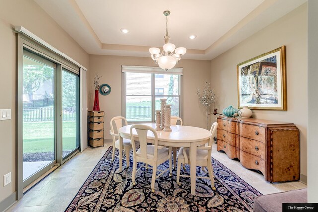 5758 N 157th St, Omaha, NE 68116 - dining space with a chandelier, plenty of natural light, a raised ceiling, and recessed lighting