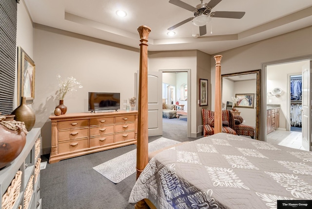 5758 N 157th St, Omaha, NE 68116 - bedroom with light carpet, ornate columns, a tray ceiling, recessed lighting, and ensuite bathroom