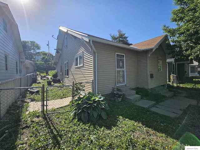 2436 S 23rd St, Omaha, NE 68108 - view of side of property with entry steps and a gate