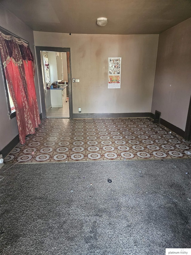 2436 S 23rd St, Omaha, NE 68108 - unfurnished room with tile patterned floors and a smoke detector