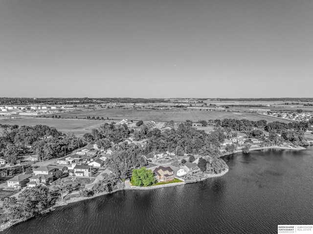 aerial view of residential area featuring a large body of water