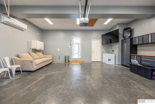 garage featuring a wall mounted air conditioner and fridge