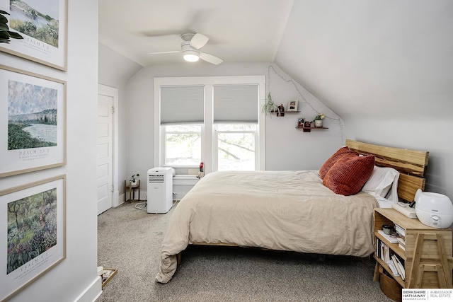 bedroom featuring vaulted ceiling, carpet floors, and a ceiling fan