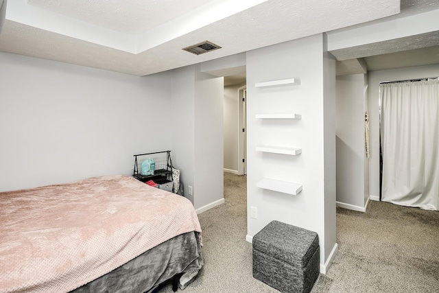 bedroom featuring carpet and baseboards