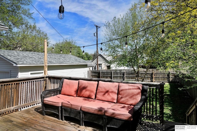 deck with outdoor lounge area and a fenced backyard