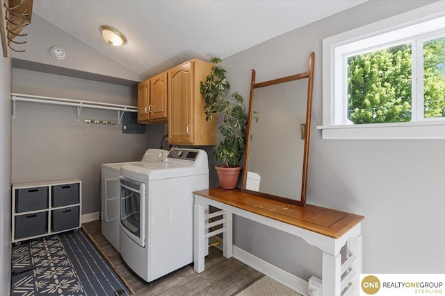 laundry area featuring washer and dryer, cabinet space, dark wood finished floors, and baseboards