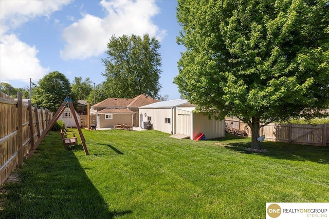 view of yard with an outdoor structure, a storage shed, and a patio