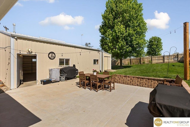view of patio / terrace with outdoor dining space and a grill