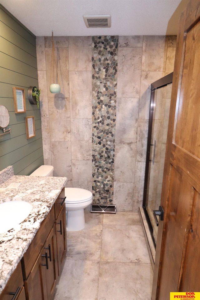 2804 Hogan Ln, Fremont, NE 68025 - full bathroom featuring a stall shower, vanity, and toilet