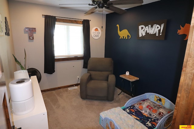 2804 Hogan Ln, Fremont, NE 68025 - living area with a ceiling fan, carpet, and baseboards