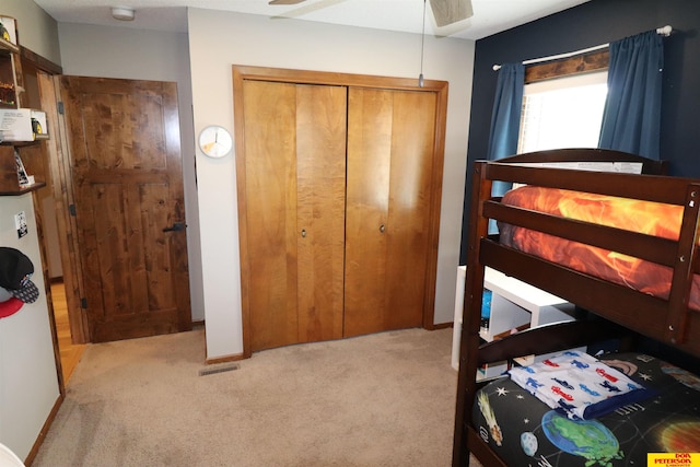 2804 Hogan Ln, Fremont, NE 68025 - carpeted bedroom with a closet, baseboards, and ceiling fan
