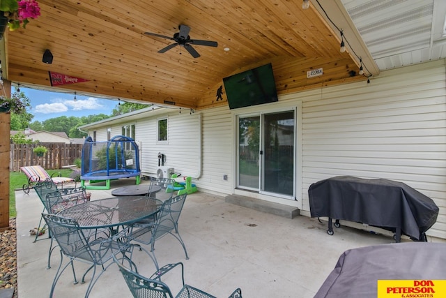 2804 Hogan Ln, Fremont, NE 68025 - view of patio / terrace with a trampoline, grilling area, ceiling fan, and outdoor dining space