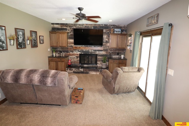 2804 Hogan Ln, Fremont, NE 68025 - carpeted living area featuring a ceiling fan, a fireplace, and baseboards