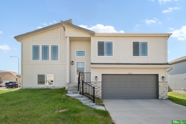 view of front of property with an attached garage, a front lawn, and concrete driveway