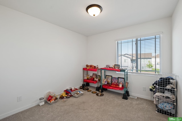 game room featuring carpet and baseboards