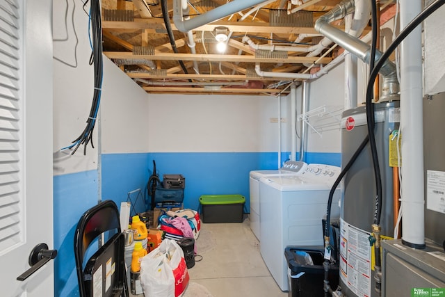 clothes washing area with independent washer and dryer and water heater