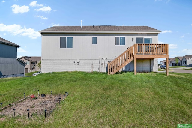 back of house featuring a deck, a yard, and stairway