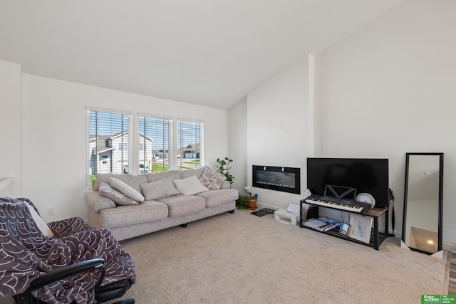 living area featuring carpet floors and vaulted ceiling