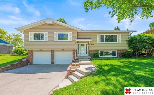 13577 Shirley St, Omaha, NE 68144 - raised ranch with a garage, driveway, a front lawn, and brick siding