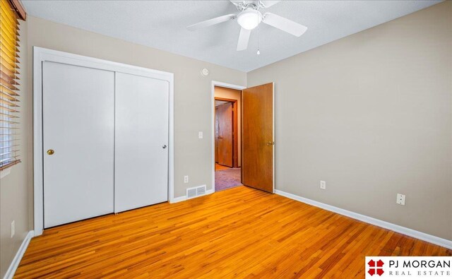 13577 Shirley St, Omaha, NE 68144 - unfurnished bedroom with light wood-type flooring, baseboards, a closet, and ceiling fan