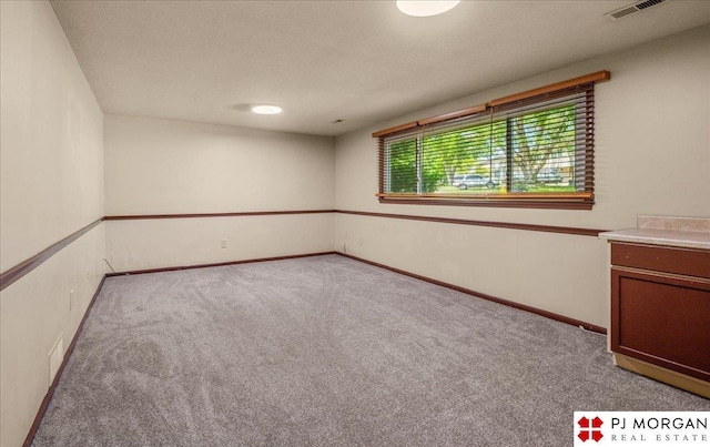 13577 Shirley St, Omaha, NE 68144 - empty room featuring carpet floors and baseboards