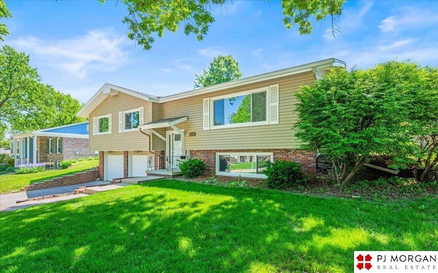 13577 Shirley St, Omaha, NE 68144 - bi-level home with an attached garage, a front lawn, brick siding, and driveway