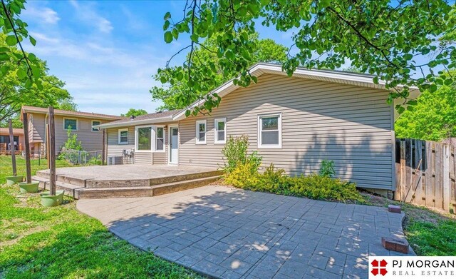 13577 Shirley St, Omaha, NE 68144 - back of property with a patio area and fence