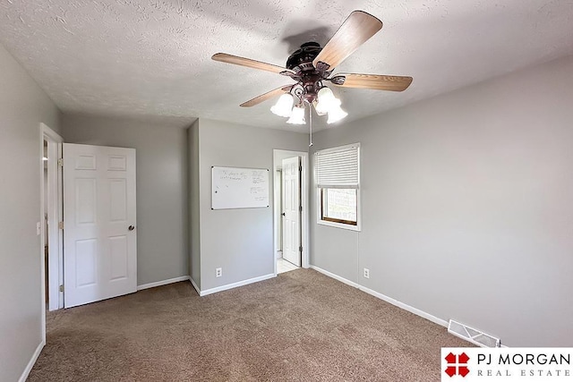 2307 N 142nd St, Omaha, NE 68164 - unfurnished bedroom with baseboards, carpet flooring, a ceiling fan, and a textured ceiling