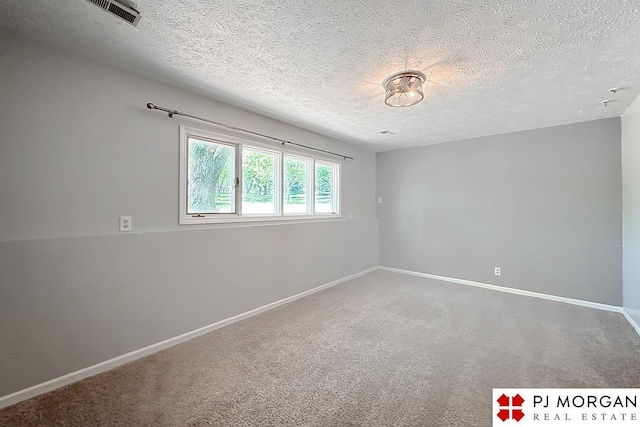 2307 N 142nd St, Omaha, NE 68164 - unfurnished room featuring a textured ceiling, baseboards, and carpet