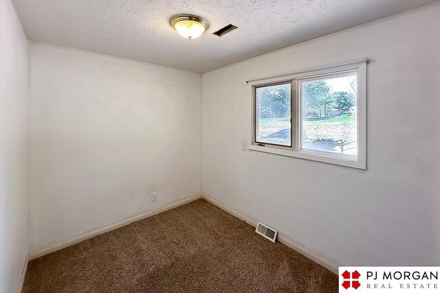 2307 N 142nd St, Omaha, NE 68164 - spare room with carpet, a textured ceiling, and baseboards
