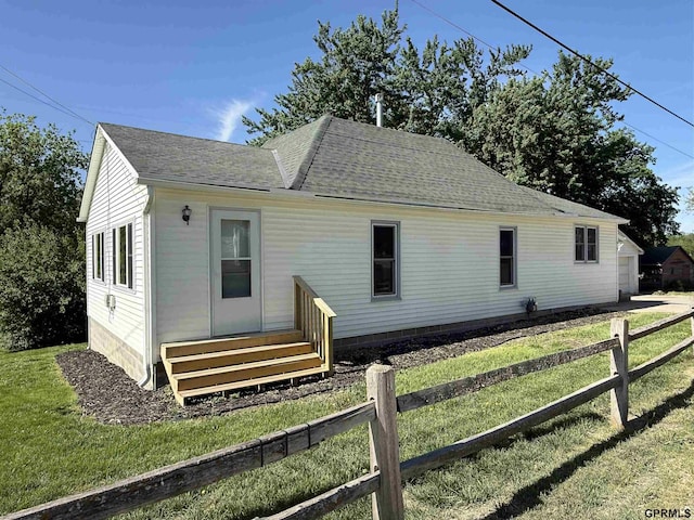 619 N 4th St, Nebraska City, NE 68410 - rear view of property with roof with shingles and entry steps