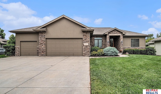 948 S 198th St, Omaha, NE 68022 - view of front of house with stone siding, a garage, stucco siding, and concrete driveway