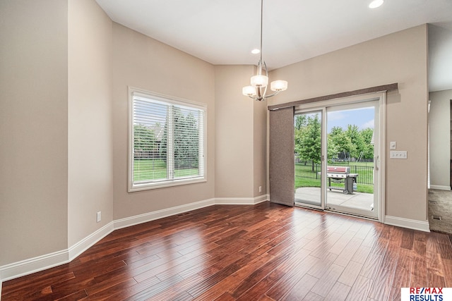 948 S 198th St, Omaha, NE 68022 - spare room featuring plenty of natural light, dark wood finished floors, a chandelier, baseboards, and recessed lighting