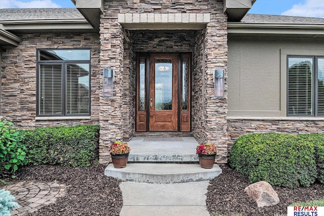 948 S 198th St, Omaha, NE 68022 - entrance to property featuring stone siding and roof with shingles