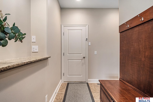 948 S 198th St, Omaha, NE 68022 - doorway to outside featuring baseboards and light tile patterned floors