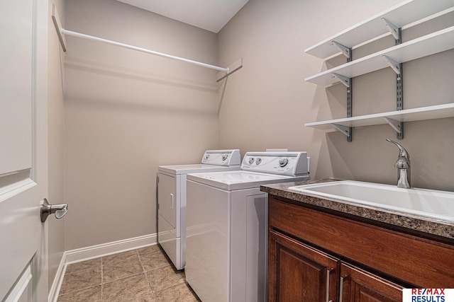 948 S 198th St, Omaha, NE 68022 - washroom with separate washer and dryer, baseboards, and cabinet space