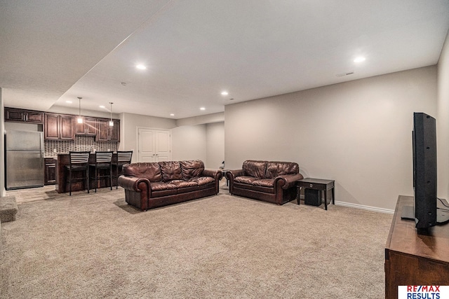 948 S 198th St, Omaha, NE 68022 - living area featuring light colored carpet, recessed lighting, a bar, and baseboards