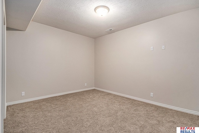 948 S 198th St, Omaha, NE 68022 - carpeted empty room featuring baseboards and a textured ceiling