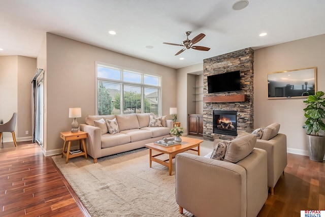 948 S 198th St, Omaha, NE 68022 - living area with wood finished floors, ceiling fan, a stone fireplace, baseboards, and recessed lighting