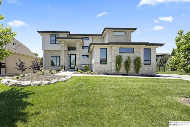 11412 S 122nd St, Papillion, NE 68046 - view of front facade featuring stone siding and a front lawn