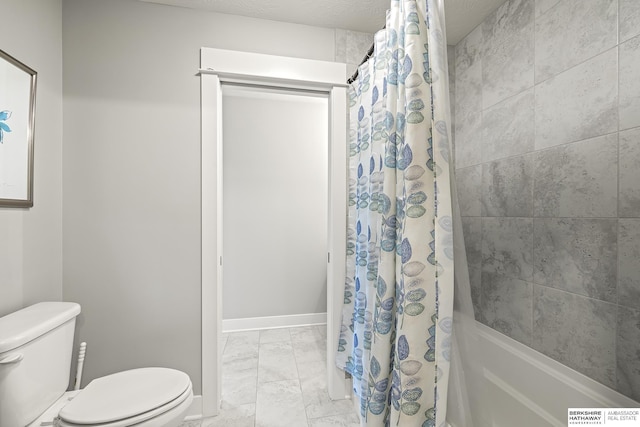 11412 S 122nd St, Papillion, NE 68046 - bathroom featuring marble finish floors, toilet, shower / bath combo with shower curtain, and baseboards