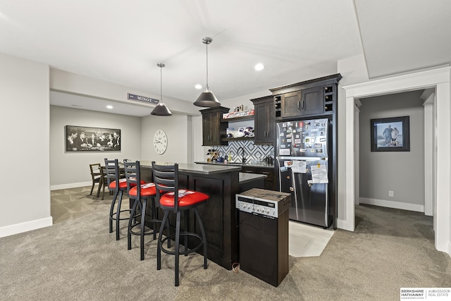 11412 S 122nd St, Papillion, NE 68046 - kitchen featuring freestanding refrigerator, light carpet, a kitchen island, open shelves, and recessed lighting